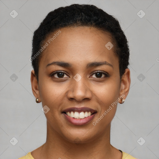 Joyful black young-adult female with short  brown hair and brown eyes