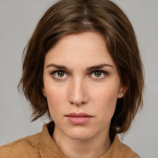 Neutral white young-adult female with medium  brown hair and green eyes