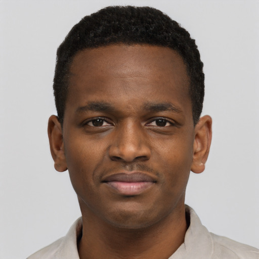 Joyful black young-adult male with short  brown hair and brown eyes