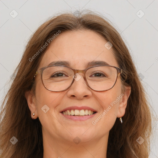 Joyful white adult female with long  brown hair and brown eyes