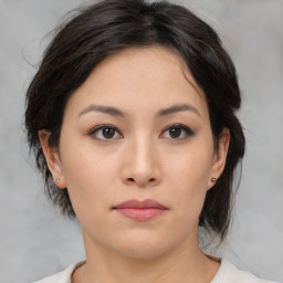 Neutral asian young-adult female with medium  brown hair and brown eyes