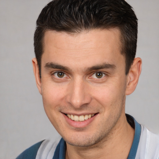 Joyful white young-adult male with short  brown hair and brown eyes