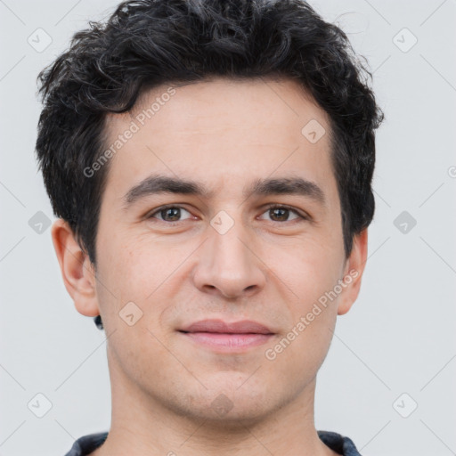 Joyful white young-adult male with short  black hair and brown eyes