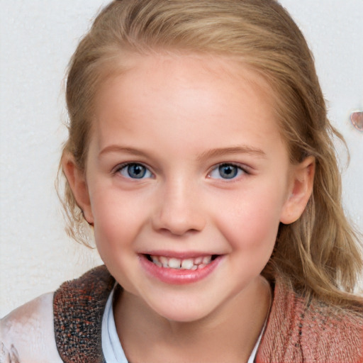 Joyful white child female with medium  brown hair and blue eyes