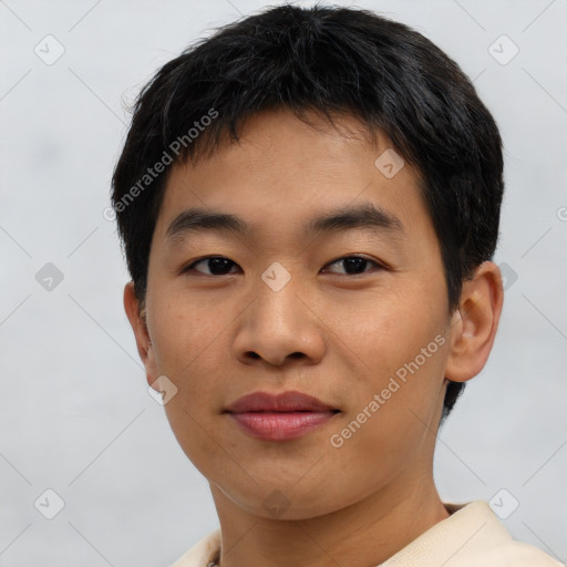 Joyful asian young-adult male with short  brown hair and brown eyes