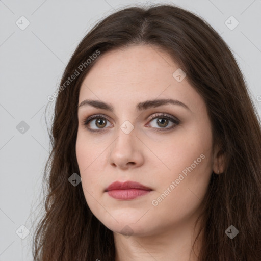 Neutral white young-adult female with long  brown hair and brown eyes