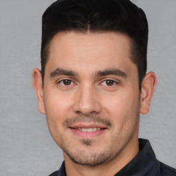 Joyful white young-adult male with short  brown hair and brown eyes