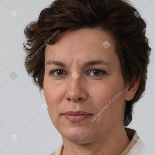 Joyful white adult female with short  brown hair and brown eyes