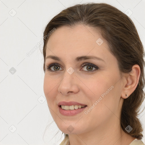 Joyful white young-adult female with medium  brown hair and grey eyes