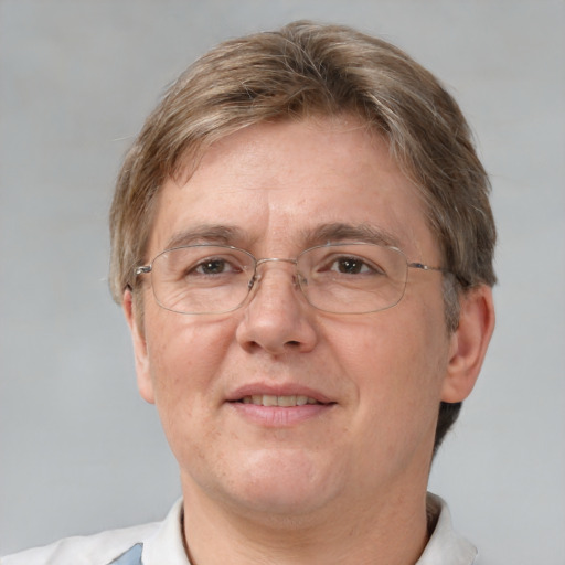 Joyful white adult male with short  brown hair and grey eyes