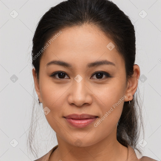 Joyful latino young-adult female with medium  brown hair and brown eyes