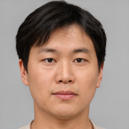 Neutral asian young-adult male with short  brown hair and brown eyes