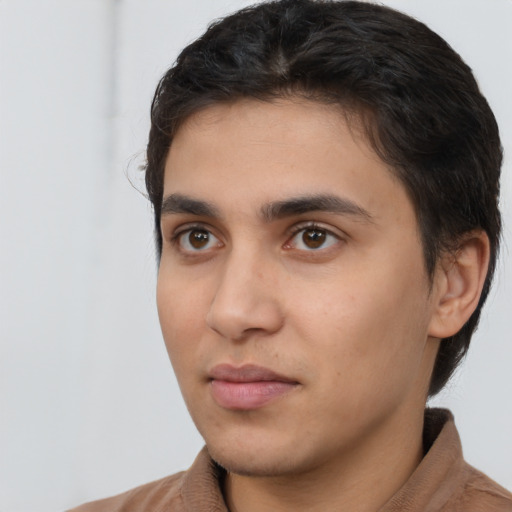 Neutral latino young-adult male with short  brown hair and brown eyes