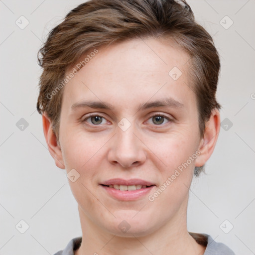 Joyful white young-adult female with short  brown hair and grey eyes