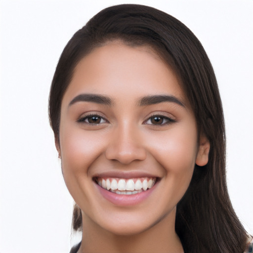 Joyful latino young-adult female with long  black hair and brown eyes