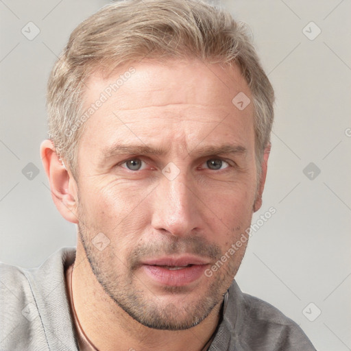 Neutral white adult male with short  brown hair and grey eyes