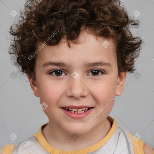 Joyful white child male with short  brown hair and brown eyes