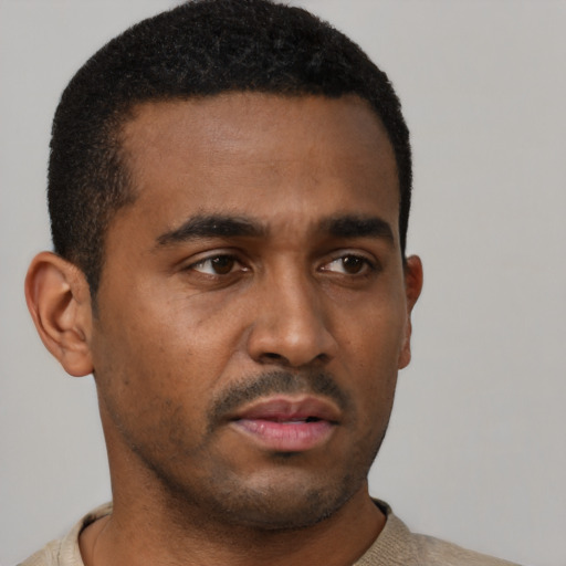 Neutral latino young-adult male with short  black hair and brown eyes