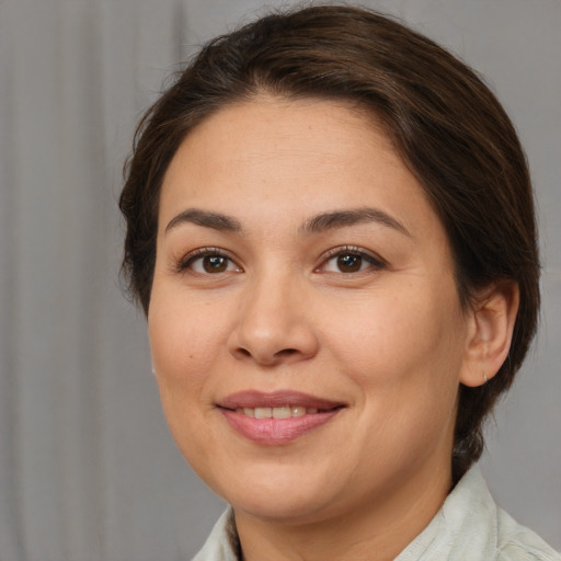 Joyful white young-adult female with medium  brown hair and brown eyes