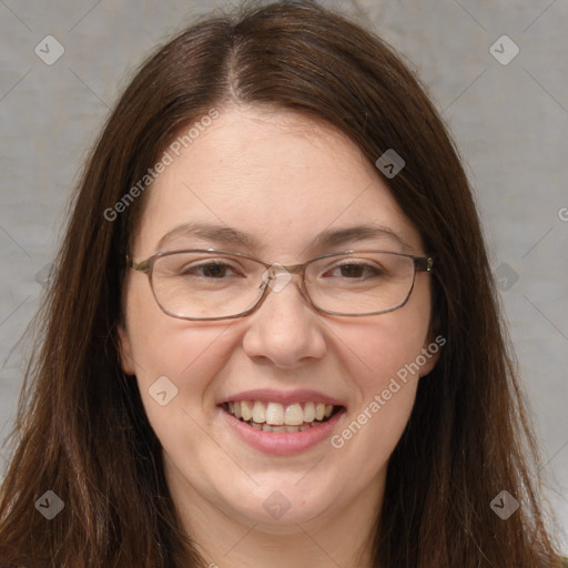 Joyful white adult female with long  brown hair and brown eyes