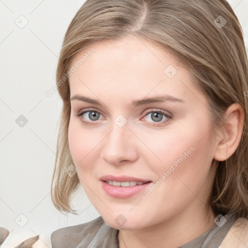 Joyful white young-adult female with medium  brown hair and blue eyes