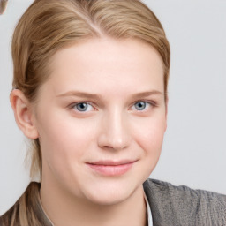 Joyful white young-adult female with short  brown hair and blue eyes