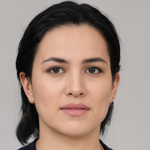 Neutral white young-adult female with medium  black hair and brown eyes