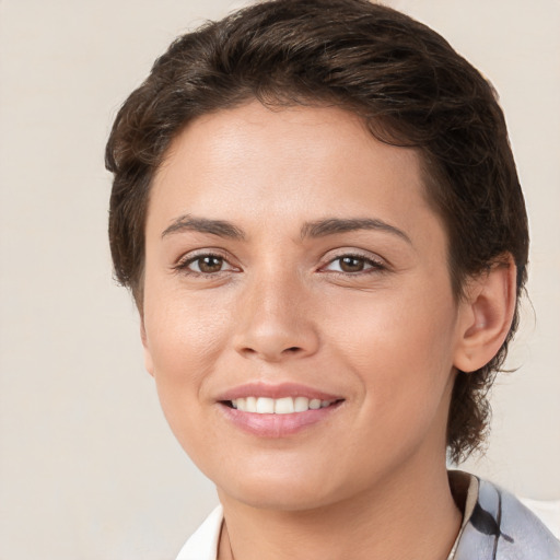Joyful white young-adult female with short  brown hair and brown eyes