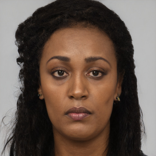 Neutral black young-adult female with long  black hair and brown eyes