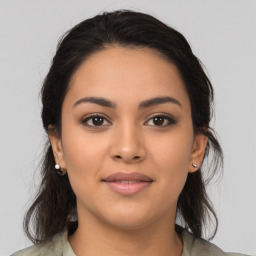 Joyful latino young-adult female with medium  brown hair and brown eyes