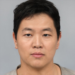 Neutral asian young-adult male with short  black hair and brown eyes