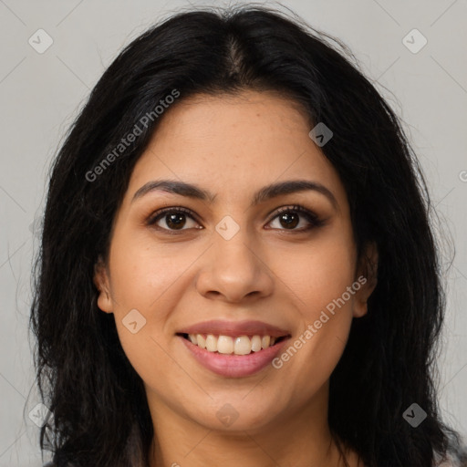 Joyful latino young-adult female with long  brown hair and brown eyes