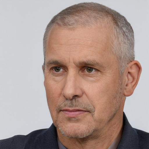 Neutral white middle-aged male with short  gray hair and brown eyes