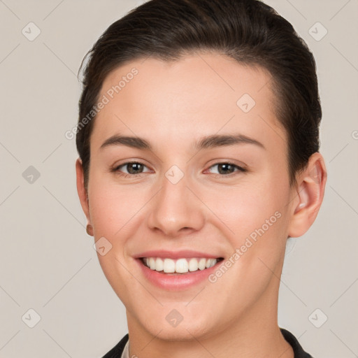 Joyful white young-adult female with short  brown hair and brown eyes