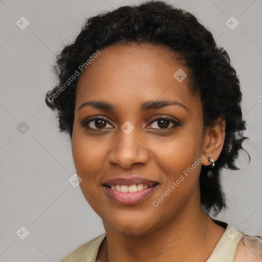 Joyful black young-adult female with medium  black hair and brown eyes