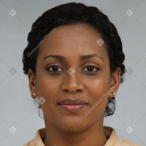 Joyful black young-adult female with short  brown hair and brown eyes