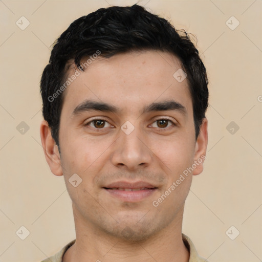 Joyful white young-adult male with short  black hair and brown eyes