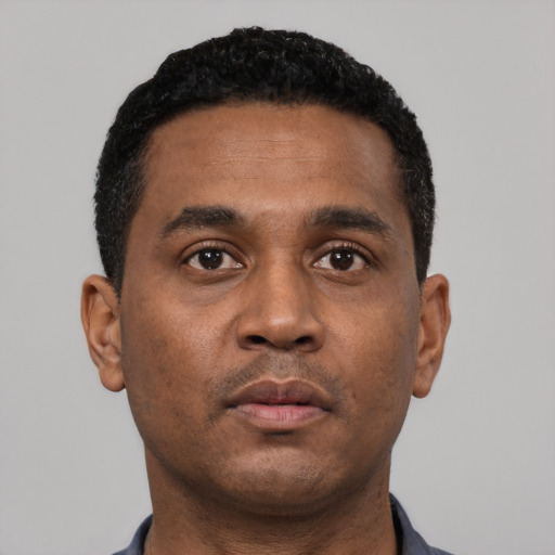 Neutral black young-adult male with short  black hair and brown eyes