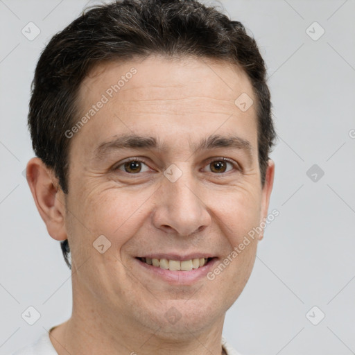 Joyful white adult male with short  brown hair and brown eyes