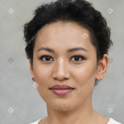 Joyful latino young-adult female with short  brown hair and brown eyes