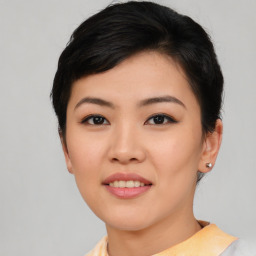 Joyful asian young-adult female with short  black hair and brown eyes