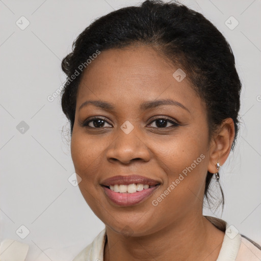 Joyful black young-adult female with short  brown hair and brown eyes