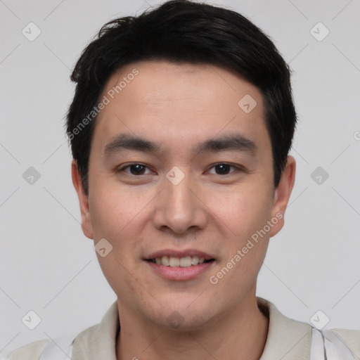 Joyful white young-adult male with short  black hair and brown eyes