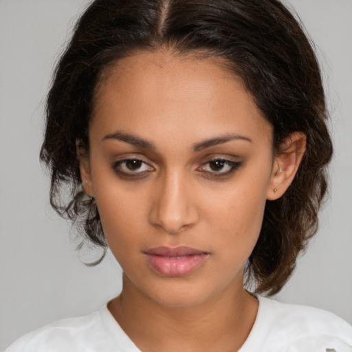 Neutral white young-adult female with medium  brown hair and brown eyes