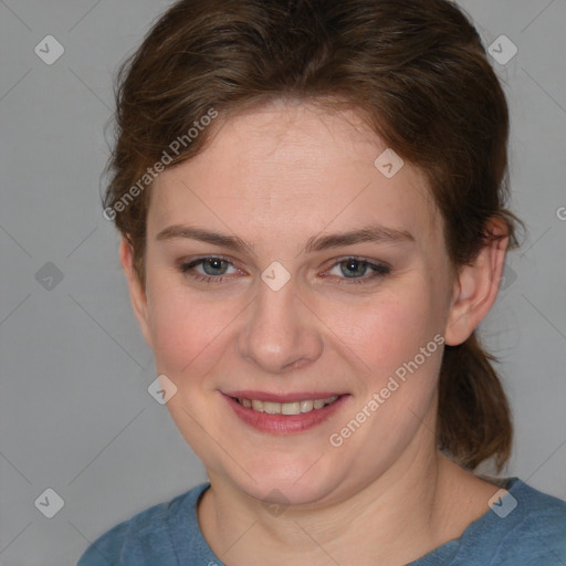 Joyful white young-adult female with medium  brown hair and blue eyes