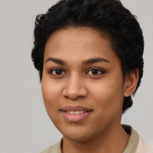 Joyful latino young-adult female with short  brown hair and brown eyes