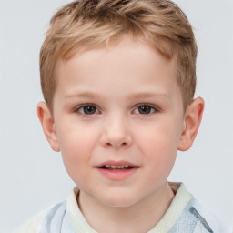 Joyful white child male with short  brown hair and brown eyes