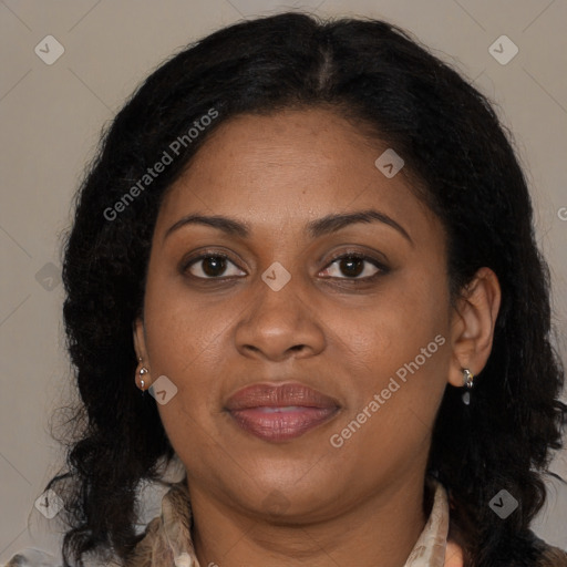 Joyful latino adult female with long  brown hair and brown eyes
