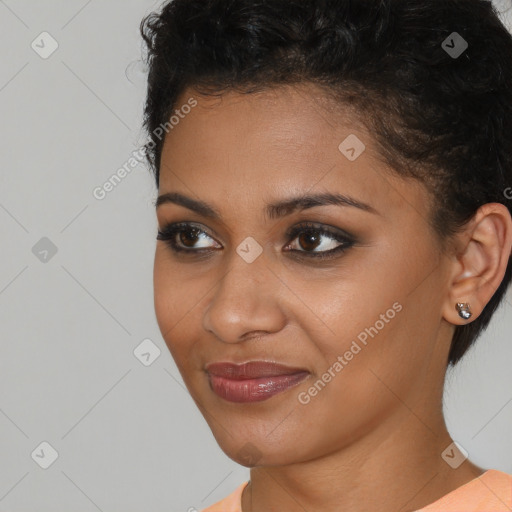 Joyful latino young-adult female with short  brown hair and brown eyes