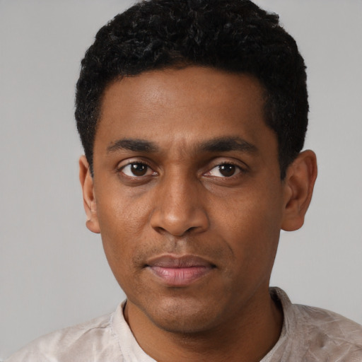 Neutral latino young-adult male with short  black hair and brown eyes